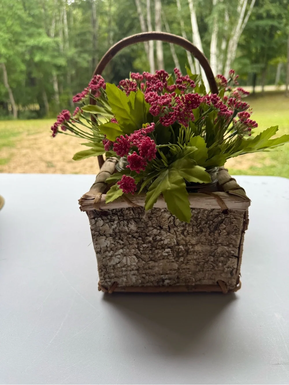 Birch basket mason jars filled with artificial flowers table decor